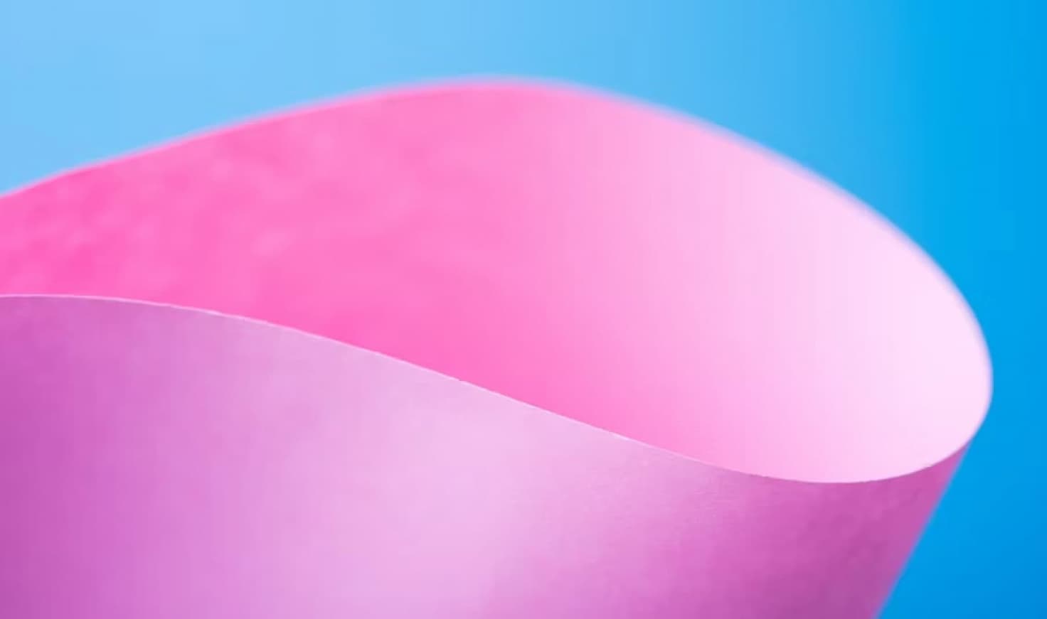 Soft pink and baby blue water ripples together in a subtle texture.